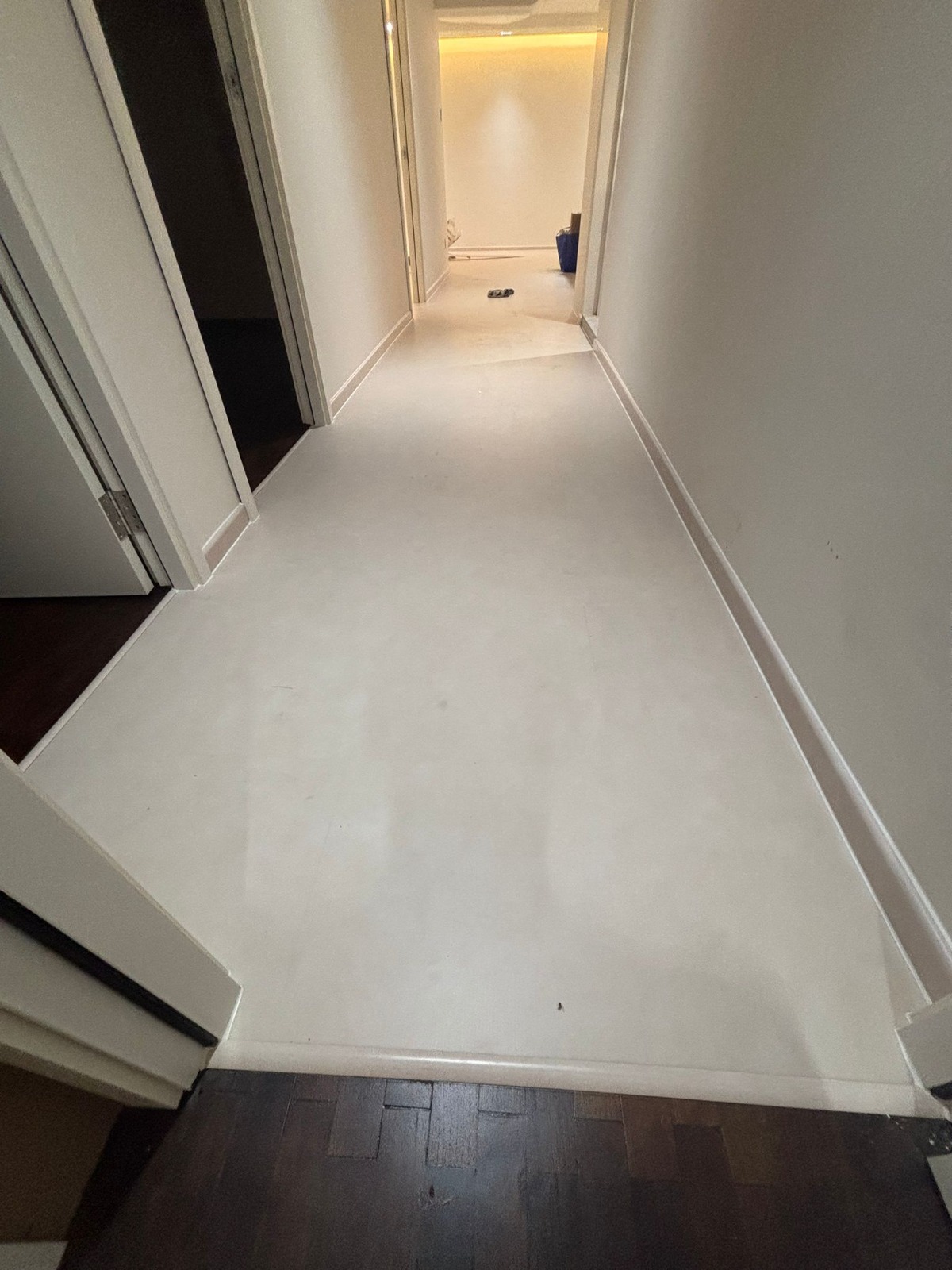 DS Flooring — residential corridor with newly installed light-grey luxury vinyl flooring