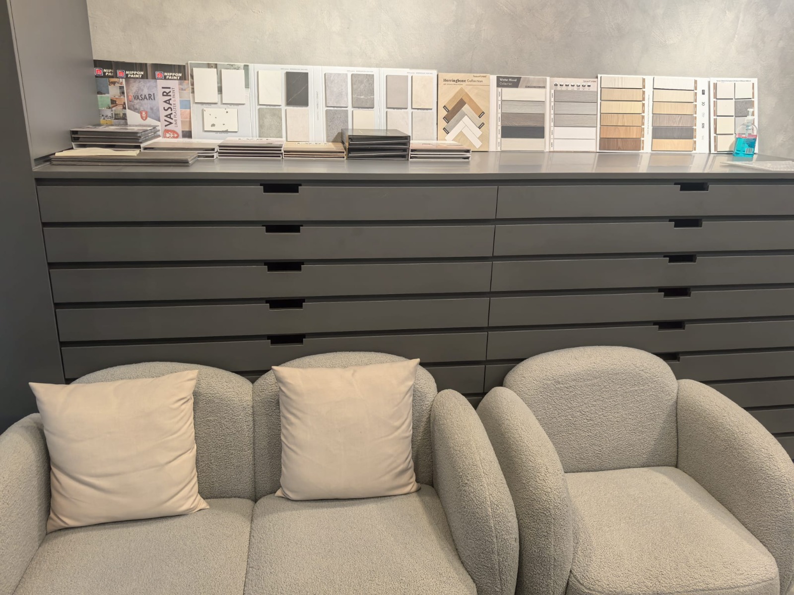 DS Flooring showroom seating area with vinyl sample boards in Singapore